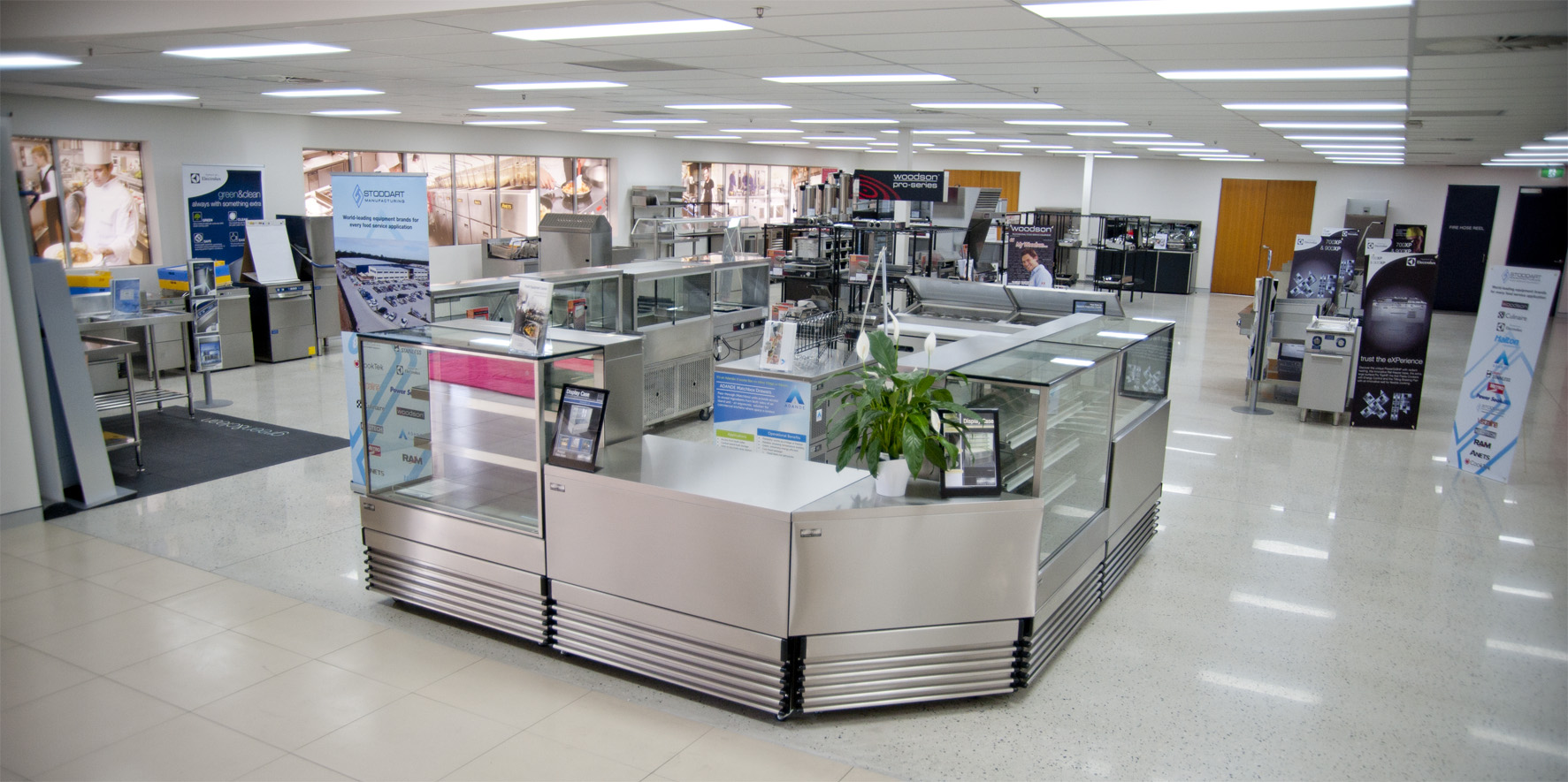 Commercial kitchen equipment sits in the middle of a showroom