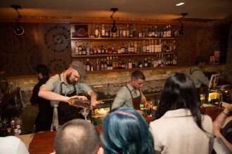 Bartenders work at Contact Bar and Kitchen in Sydney