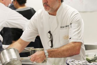 Peter Gordon prepares dishes for a Dining with a Difference event