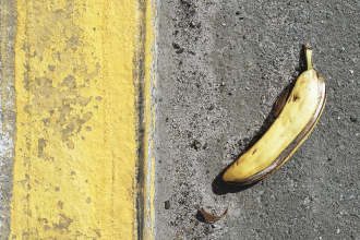 Banana peel on sidewalk