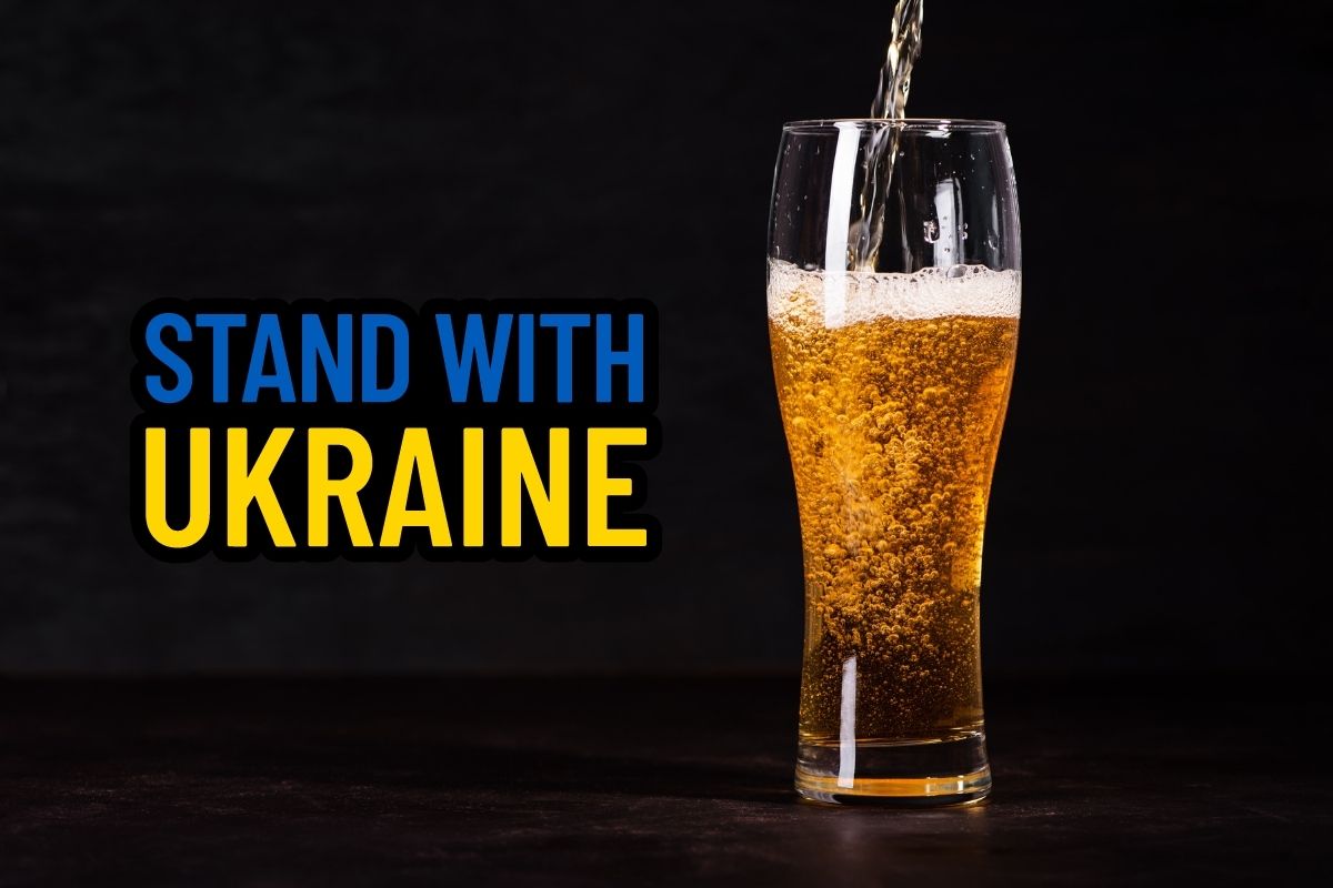 Pint of beer with the text "Stand with Ukraine"
