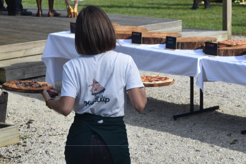 girl carrying pizzas