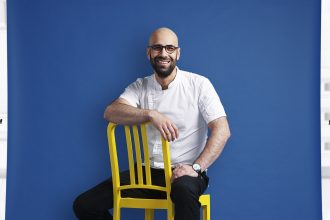 Male Chef sitting on chair smiling